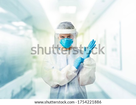 Doctors in the protective suits and masks are ready for examining the infected aging in the control area of hospital. Royalty-Free Stock Photo #1754221886