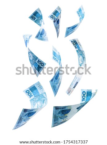 banknotes of one hundred reais from brazil falling on isolated white background. Fall of the Brazilian currency, devaluation, economic crisis.