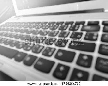 blurred Laptop computer keyboard.for background, Black and white picture 