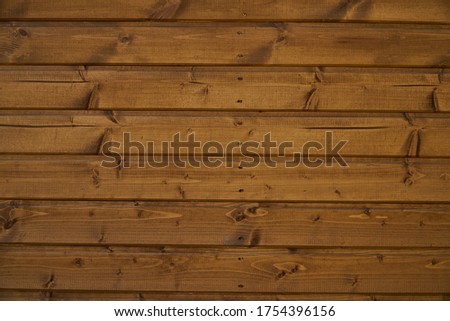 Wooden wall. The texture of the timber. Brown nature background. High quality photo