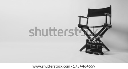 Director chair with black clapper board or movie slate on white background.it is used in video production and film industry. Royalty-Free Stock Photo #1754464559