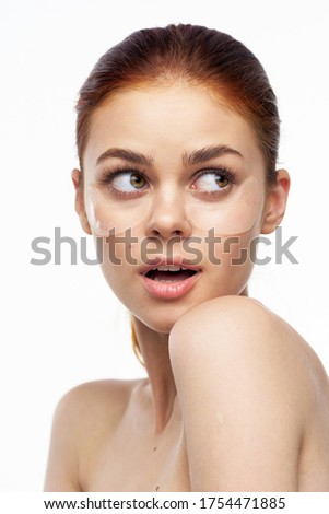 skin care mask against bags under the eyes of a woman