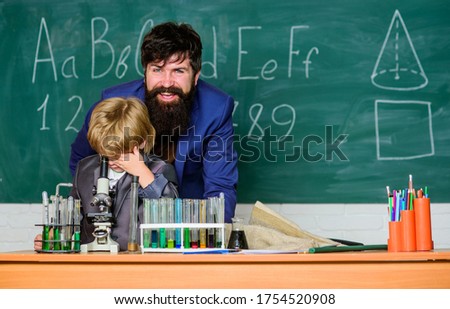 Biodiversity we should keep. Chemistry and physics biology. son and father at school. Flask in scientist hand with Test tubes. Wisdom. Back to school. small boy with teacher man.
