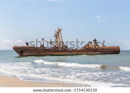 View of a abandoned ships carcasses in the ships cemetery, graveyard ships on the atlantic ocean, Angola, Africa Royalty-Free Stock Photo #1754530130