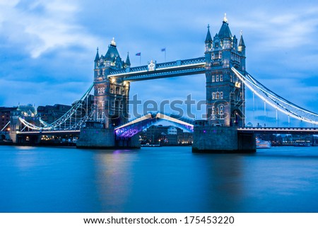 Rare image of Tower Bridge in London opening at night