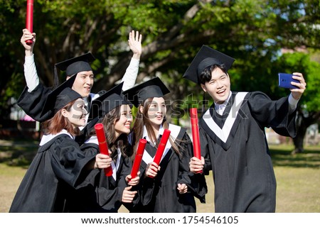 group happy graduates students use mobile phone to take usie together