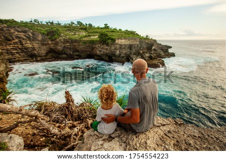 Father with son by the ocean