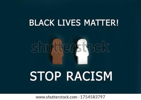 Black and white figures of people on a black background. The inscription in chalk-Stop racism. Motivational poster against racism and discrimination.