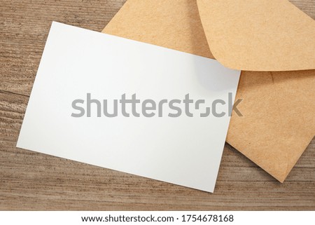 Mock up blank business card and envelope on the table