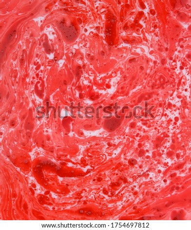 Abstract photographs of color mixing of water, acrylic,oil and milk for use as background image. Acrylic texture with beautiful pattern, close up multi color background photo.