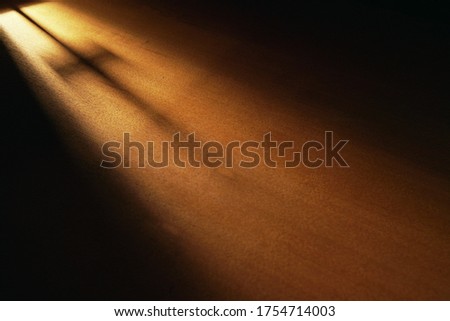 Light and cross shadow on wooden board, dark room, light and hope, faith