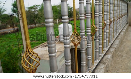Image of a decorative cast iron railings. Metal guardrail close up. abstract metal in englan london railing steel and green background