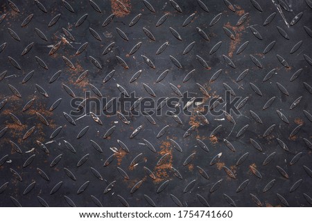 A rusty steel panel background.