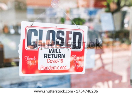 Red Closed sign on door entrance cafe restaurant or business office store is closed due to the effect of Coronavirus COVID-19 pandemic