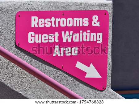 Restrooms and Guest Waiting Area With Arrow