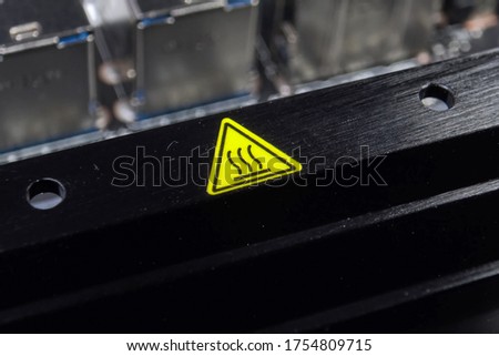 Yellow hot surface sign. Designation of a hot radiator.