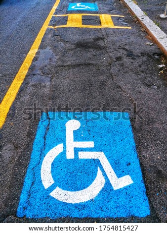 Road signs for parking the disabled on the road surface