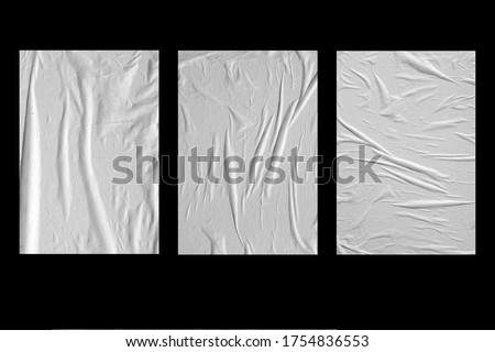 Three white crumpled sheets of paper on a black background. Royalty-Free Stock Photo #1754836553