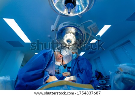 Surgical room in hospital with robotic technology equipment, machine arm surgeon in futuristic operation room. Minimal invasive surgical innovation, medical robot surgery with endoscopy Royalty-Free Stock Photo #1754837687