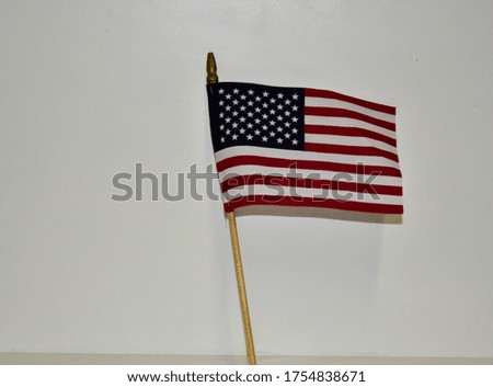 United States flag on white background, standing straight up