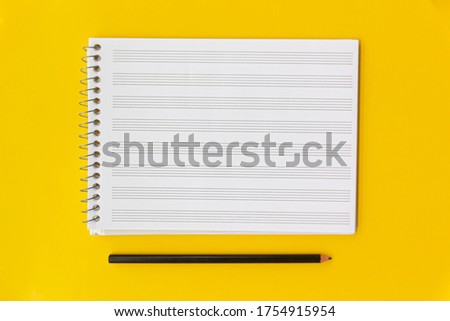 Score book with a pencil