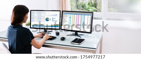 Analyst Employee Working With Spreadsheet On Computer