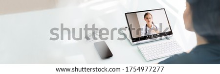 Online Video Conference Call With Doctor On Laptop Royalty-Free Stock Photo #1754977277