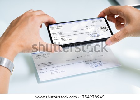 Scanning Remote Deposit Check Document Using Phone. Taking Photo Royalty-Free Stock Photo #1754978945