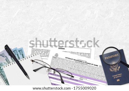 Department of State form DS60 Affidavit Regarding a change of name lies on table and ready to fill. Paperwork during operations with US Passport concept Royalty-Free Stock Photo #1755009020