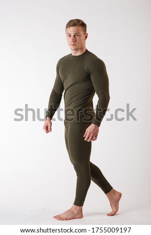 The guy in thermal underwear on a white background. Sportswear.