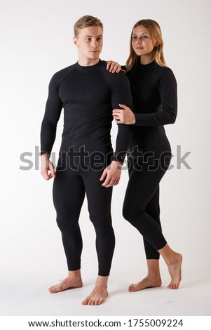 Guy and girl in thermal underwear on a white background