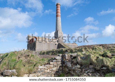 Landscape photo of an abandoned building from the mining industry on the Cornish caost