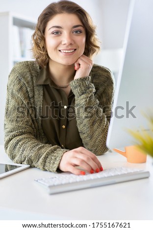Young woman looking in laptop display watching training course
