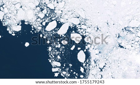Glaciers and ice melting in the North, satellite image showing the environmental situation in the Northern region, global warming. contains modified Copernicus Sentinel data Royalty-Free Stock Photo #1755179243