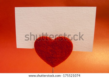 Heart-shaped clip holding a blank card