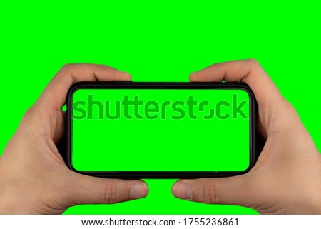 Hands Holding Smartphone Isolated on a Green Screen Background ( edit now )