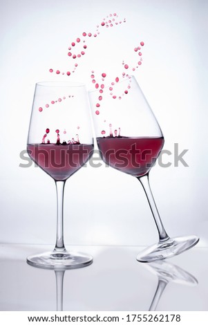 red wine glasses simulating love couple with message i love you with wine drops