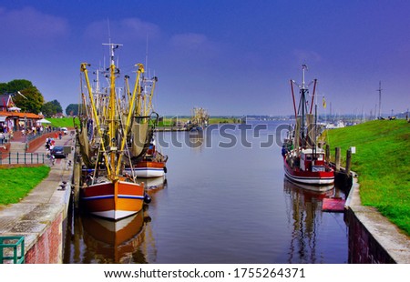 Greetsiel harbor is a small town on the North Sea Royalty-Free Stock Photo #1755264371