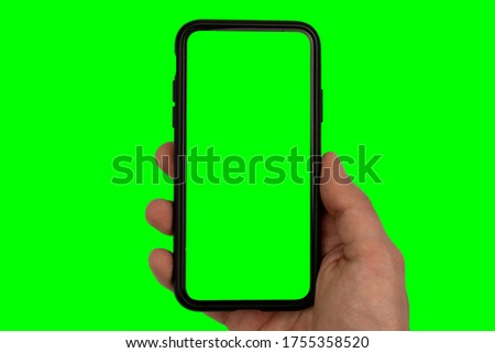Mans Hand Holding Smartphone Isolated on a Green Screen Background