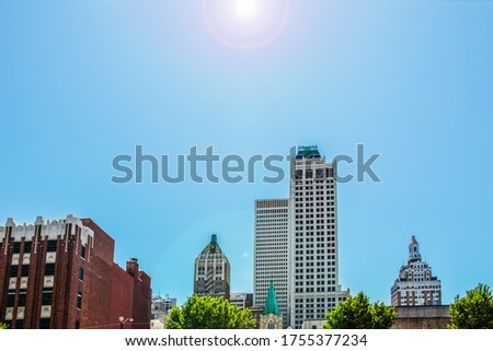 Art Deco and modern buildings skyline of Tulsa OK USA with lens flare
