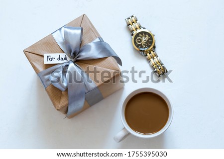 gift in craft packaging  on white background for Father's Day, give, a gift for the holiday, for dad