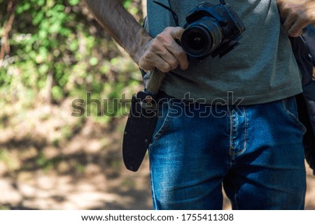 man photographer in hand camera