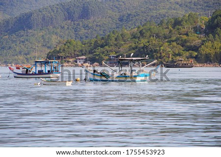 wooden fisherman boats in sea water