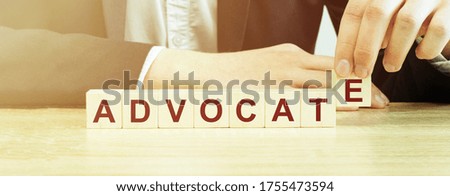 Man made word advocate with wood blocks