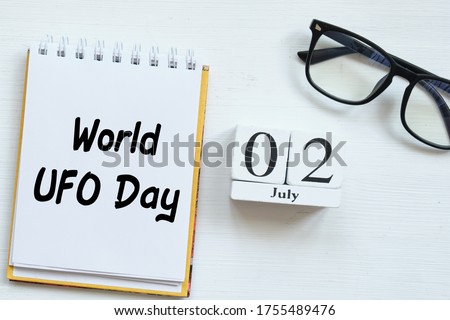 2th july World UFO Day second of month calendar concept on wooden blocks