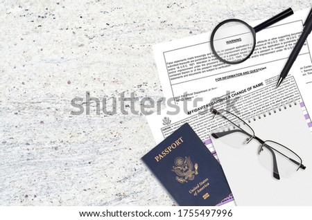 Department of State form DS60 Affidavit Regarding a change of name lies on table and ready to fill. Paperwork during operations with US Passport concept Royalty-Free Stock Photo #1755497996