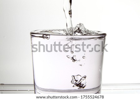 Pouring water into the glass