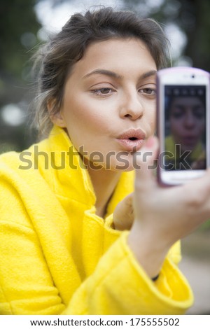 young woman  with a smartphone.vertical shot