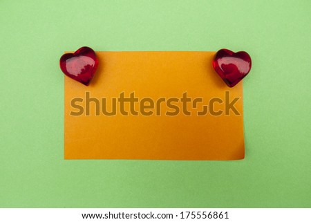 Magnets hearts on different colored backgrounds. Blank paper to fill with text