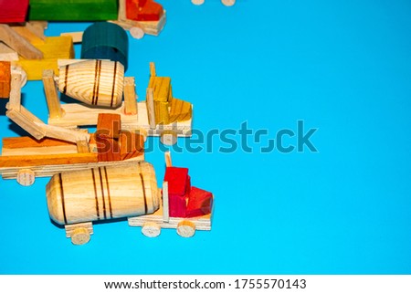Picture of wooden mexican toys. They are several trucks for little boys.